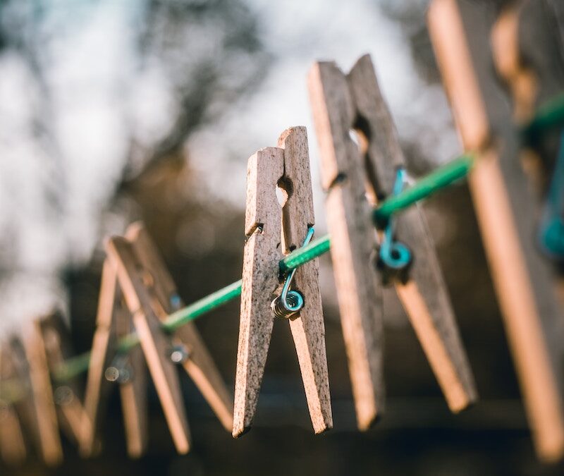 Photo of pegs on a washing line. Photo by Nong on Unsplash