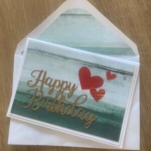 Green happy birthday card with red hearts