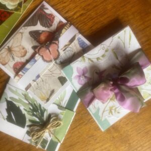 Three different fold out cards. Flowers, butterflies or foliage.